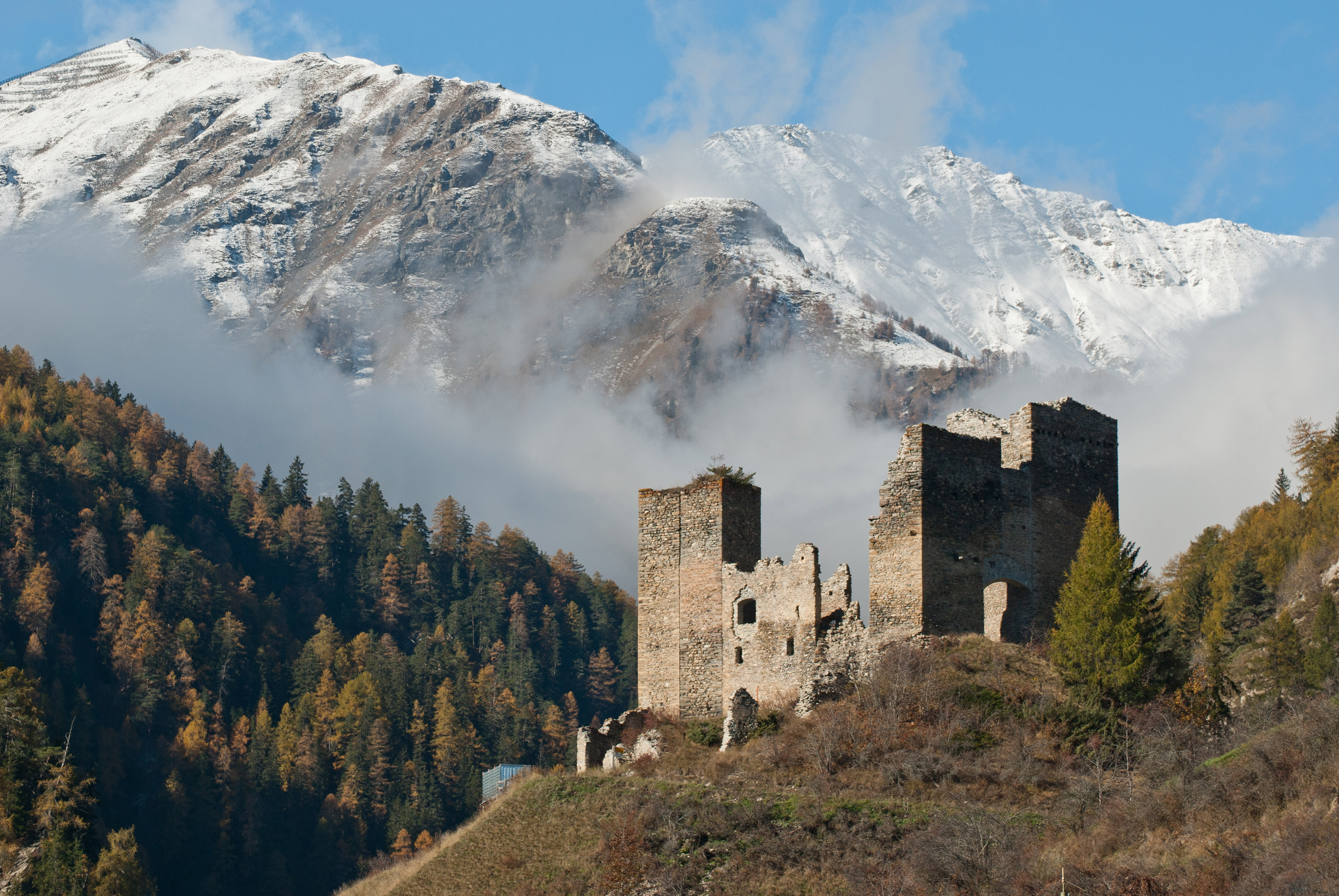 Tschanüff castle, in the background parts of the Piz Spadla mountain, in Switzerland